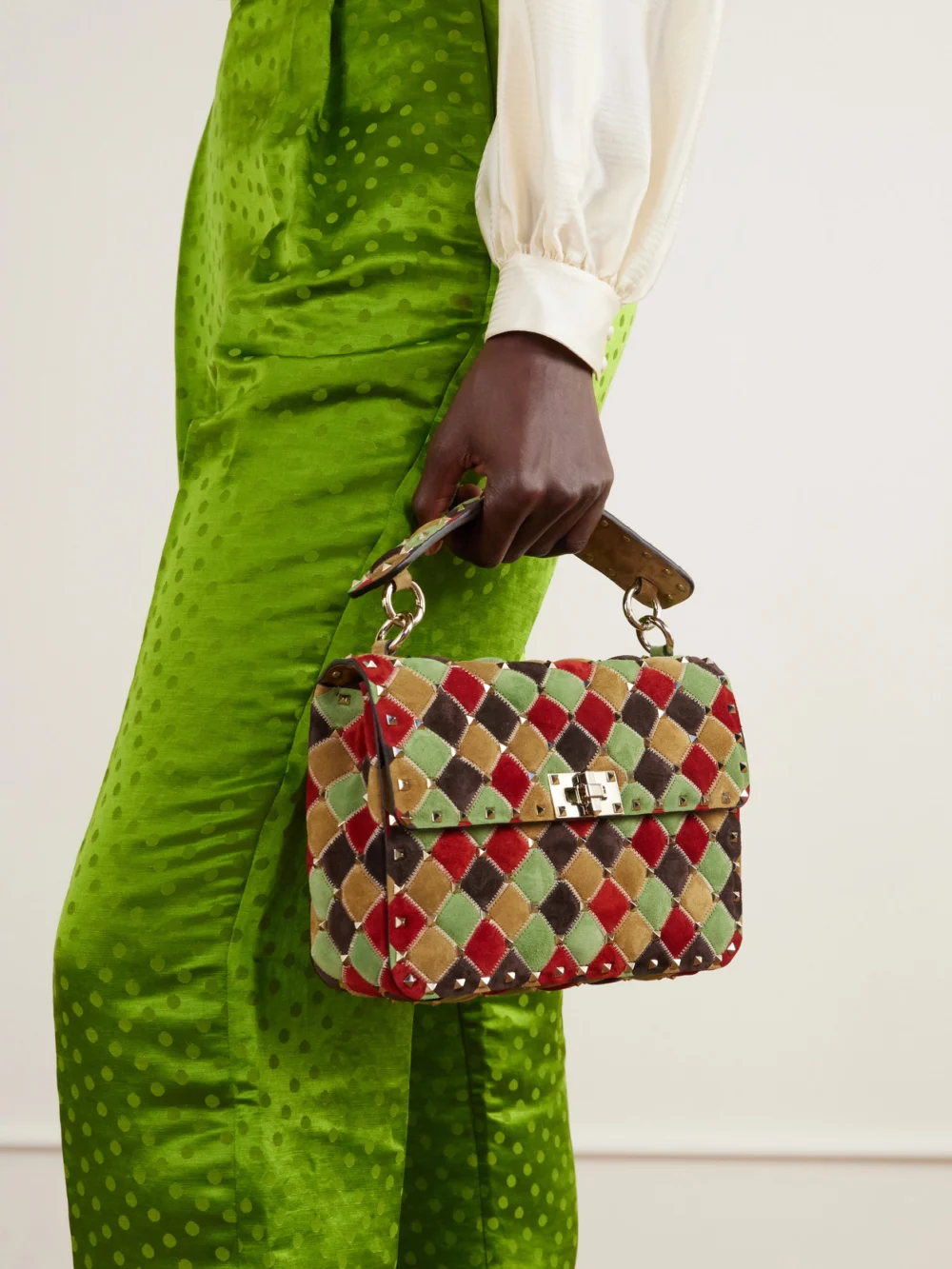 Valentino Garavani Rockstud Spike Studded Suede Shoulder Bag, styled view