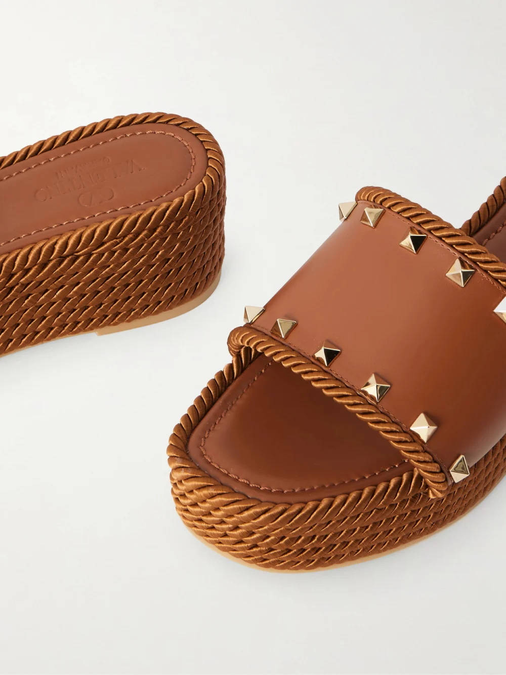 Close-up detail of the Valentino Garavani Rockstud Torchon Leather Platform Espadrille Slides