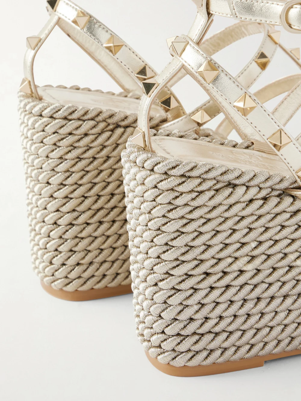 Close-up detail of the Valentino Garavani Rockstud Tourchon Metallic Leather Espadrille Wedge Sandals