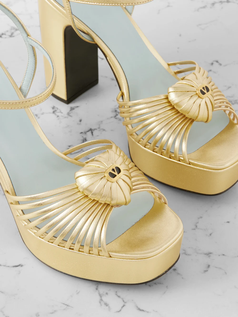Close-up detail of the Valentino Garavani Royal 115 Embellished Metallic Leather Platform Sandals