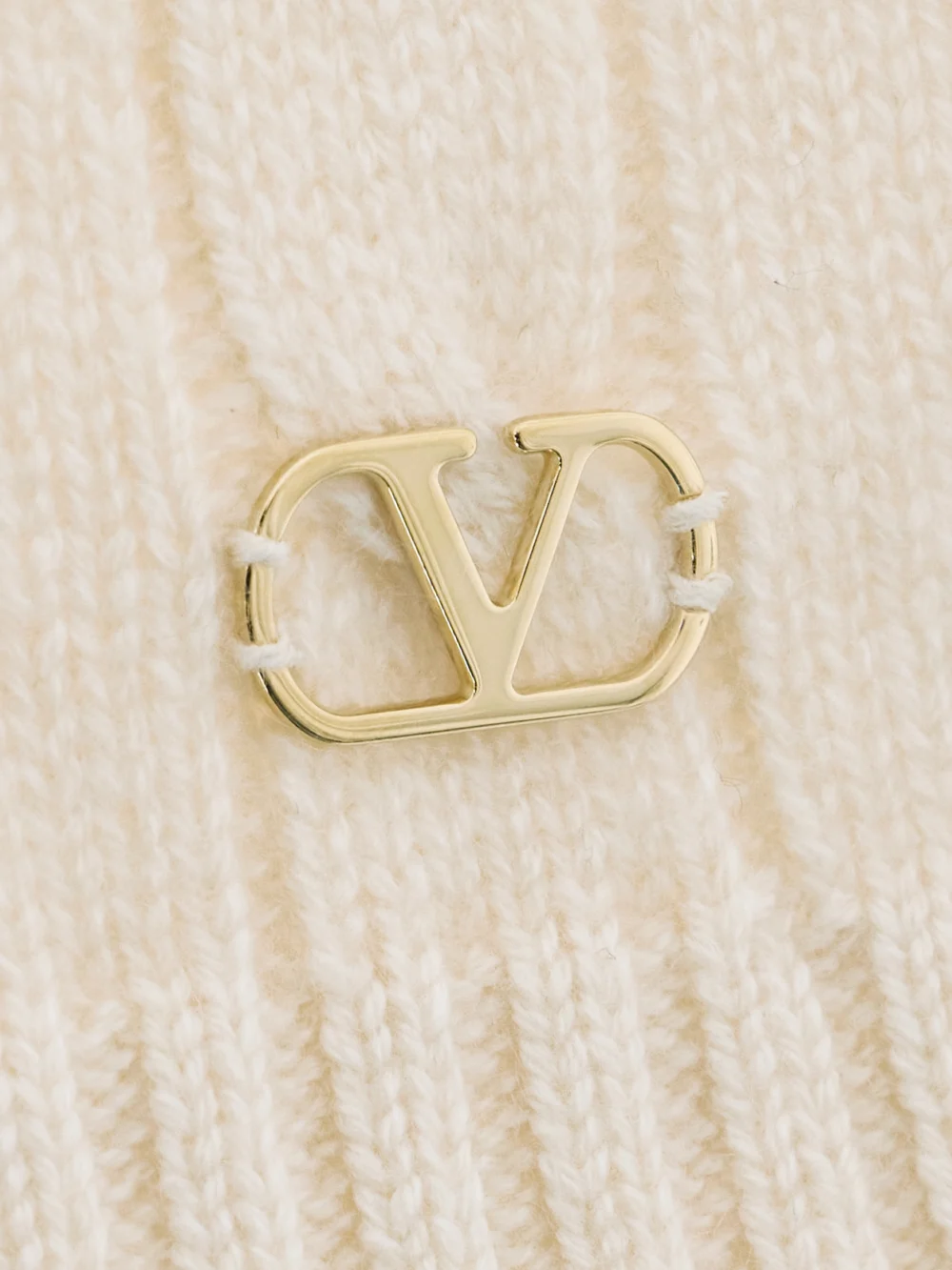 Close-up detail of the Valentino Garavani Ruffle-trimmed Embellished Cable-knit Cashmere Sweater