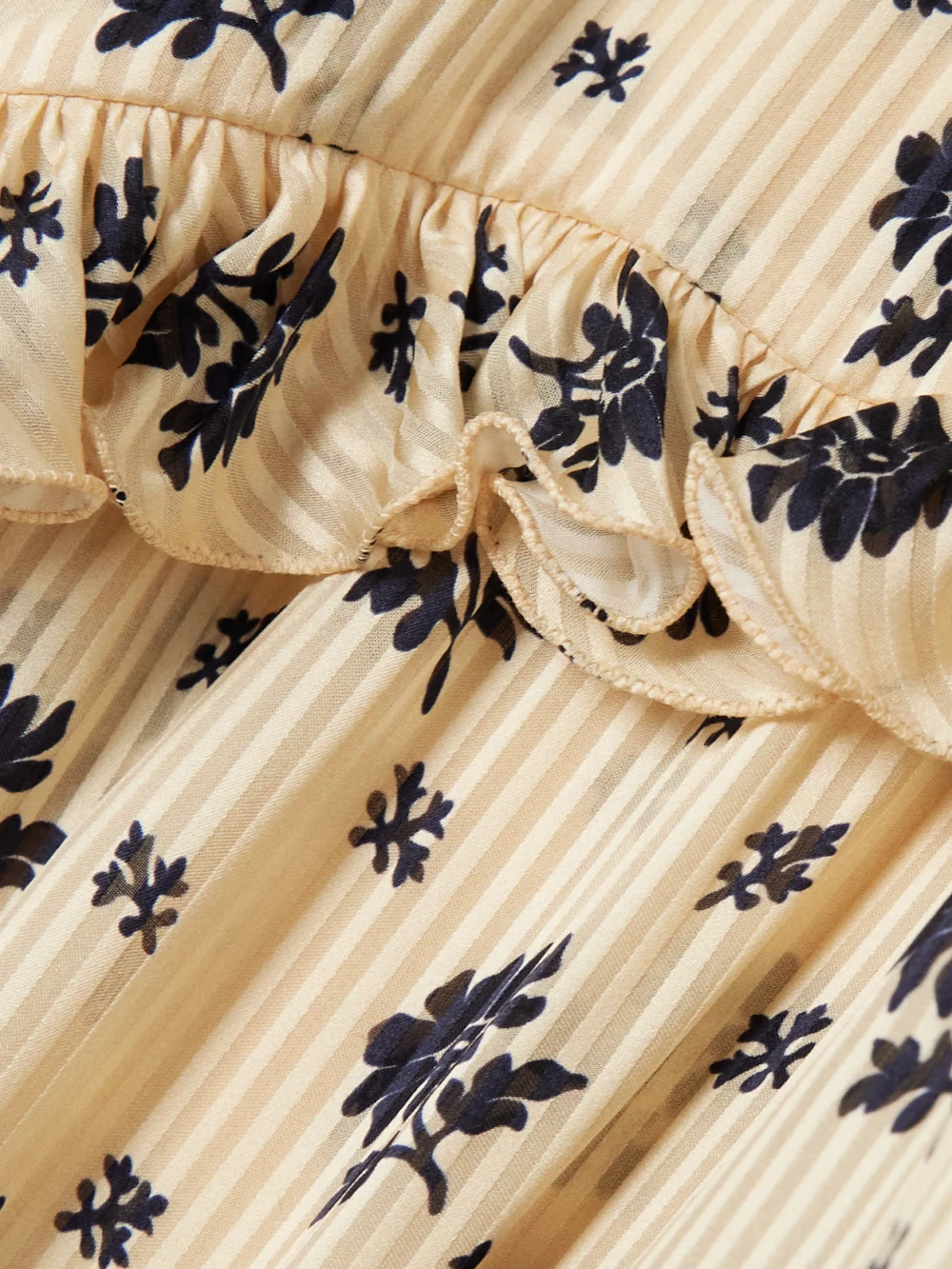 Close-up detail of the Valentino Garavani Ruffled Printed Striped Silk-jacquard Blouse