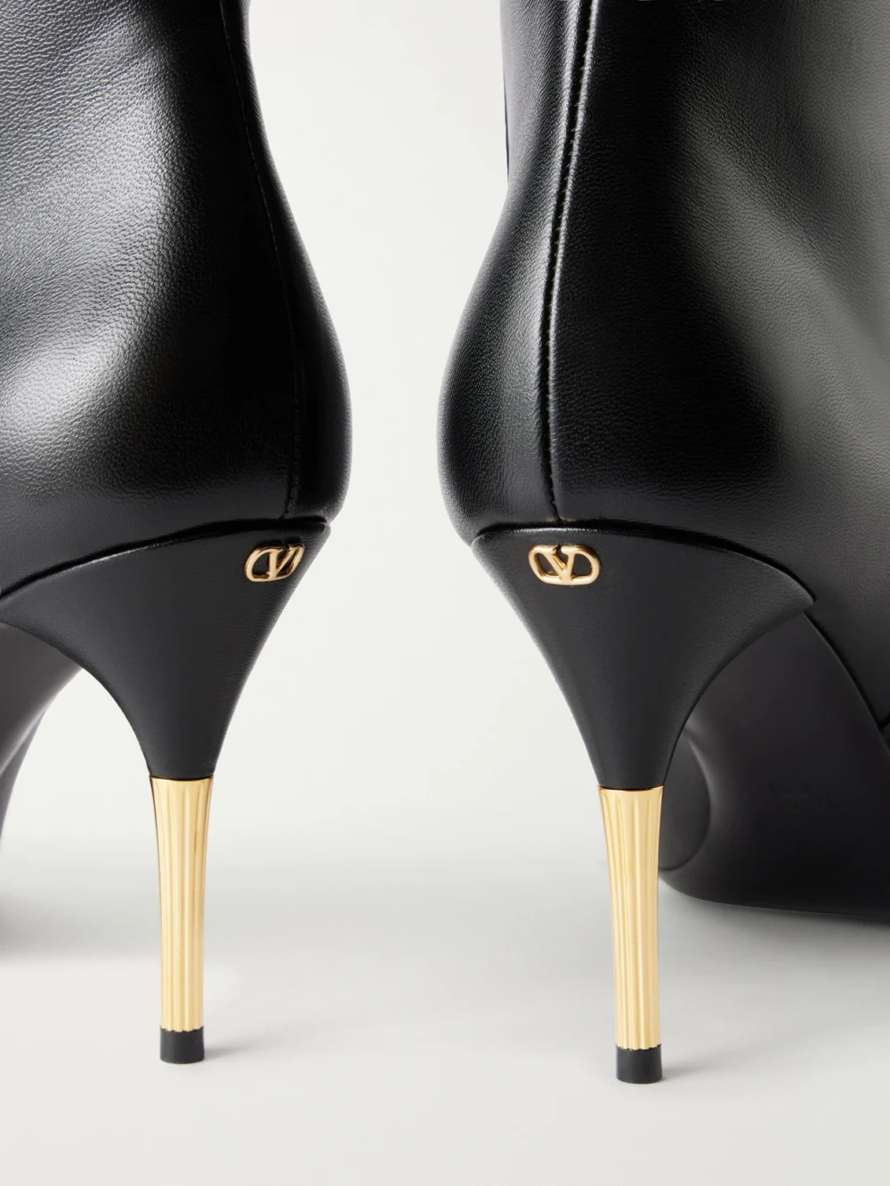 Close-up detail of the Valentino Garavani Sinead Bootie 85 Suede-trimmed Leather Ankle Boots