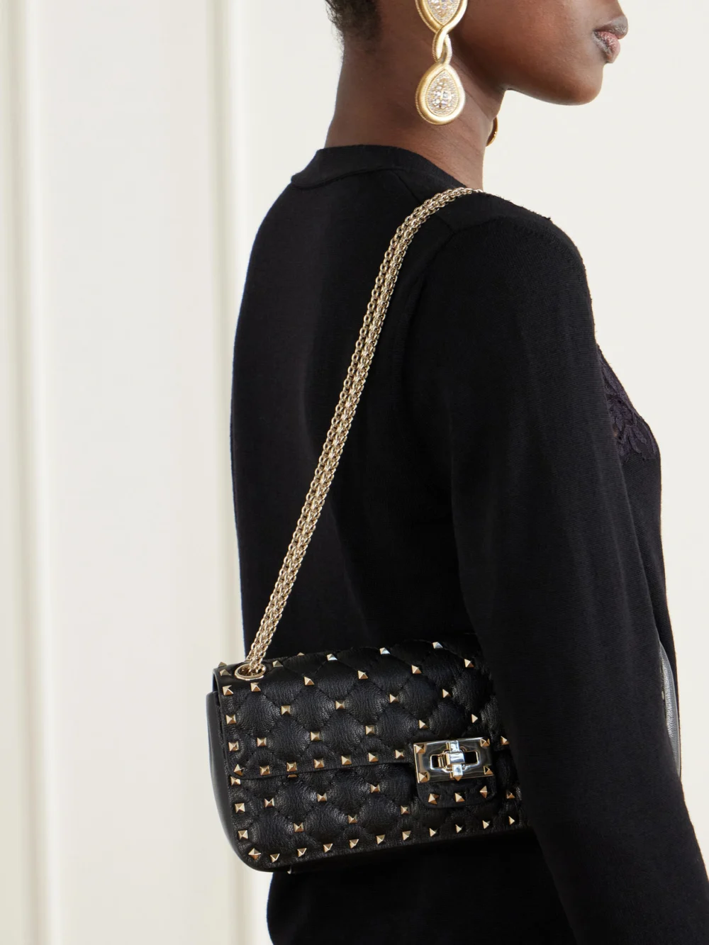 Valentino Garavani Spike Small Studded Quilted Leather Shoulder Bag, styled view