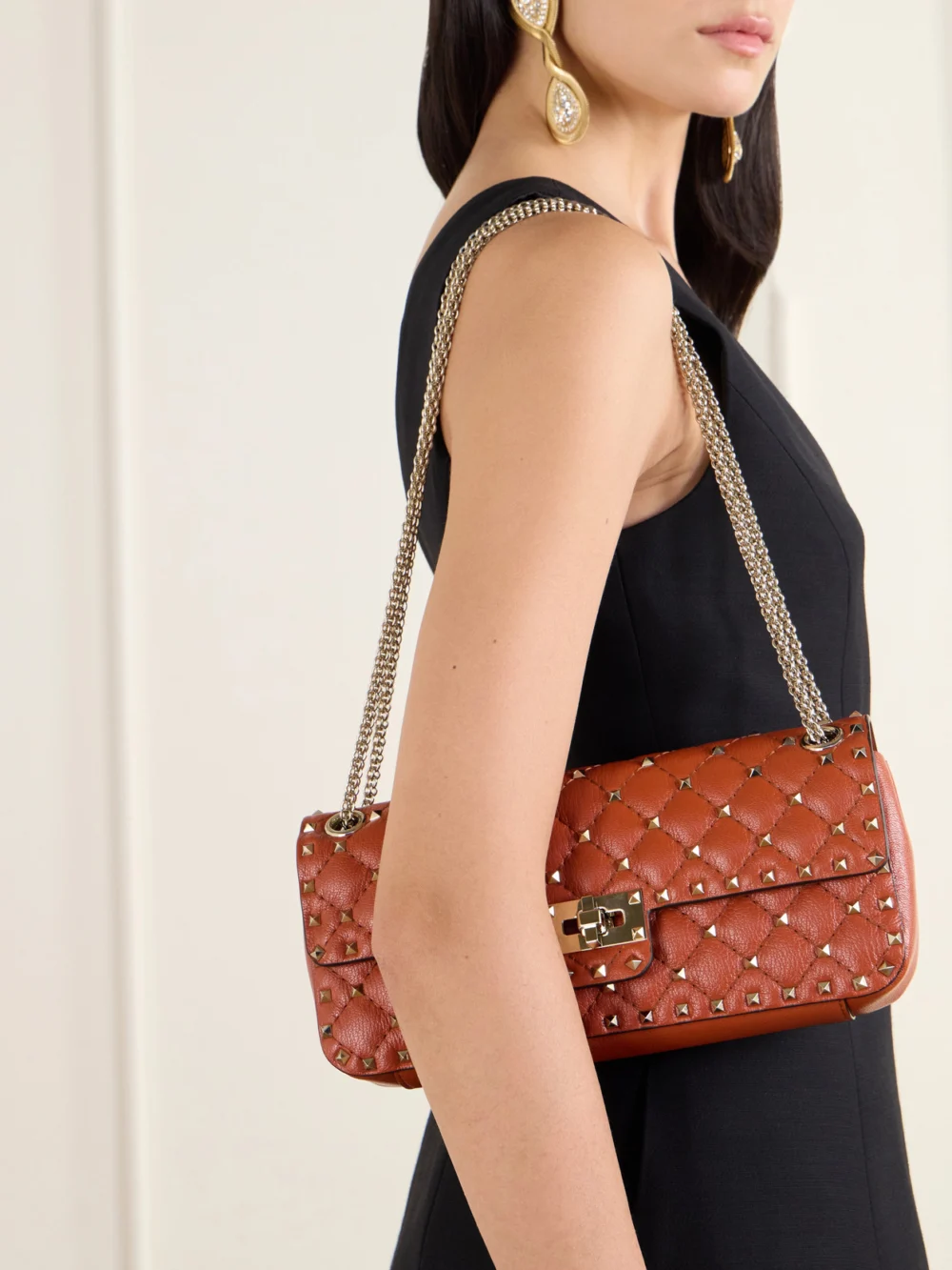 Valentino Garavani Spike Small Studded Quilted Leather Shoulder Bag, styled view