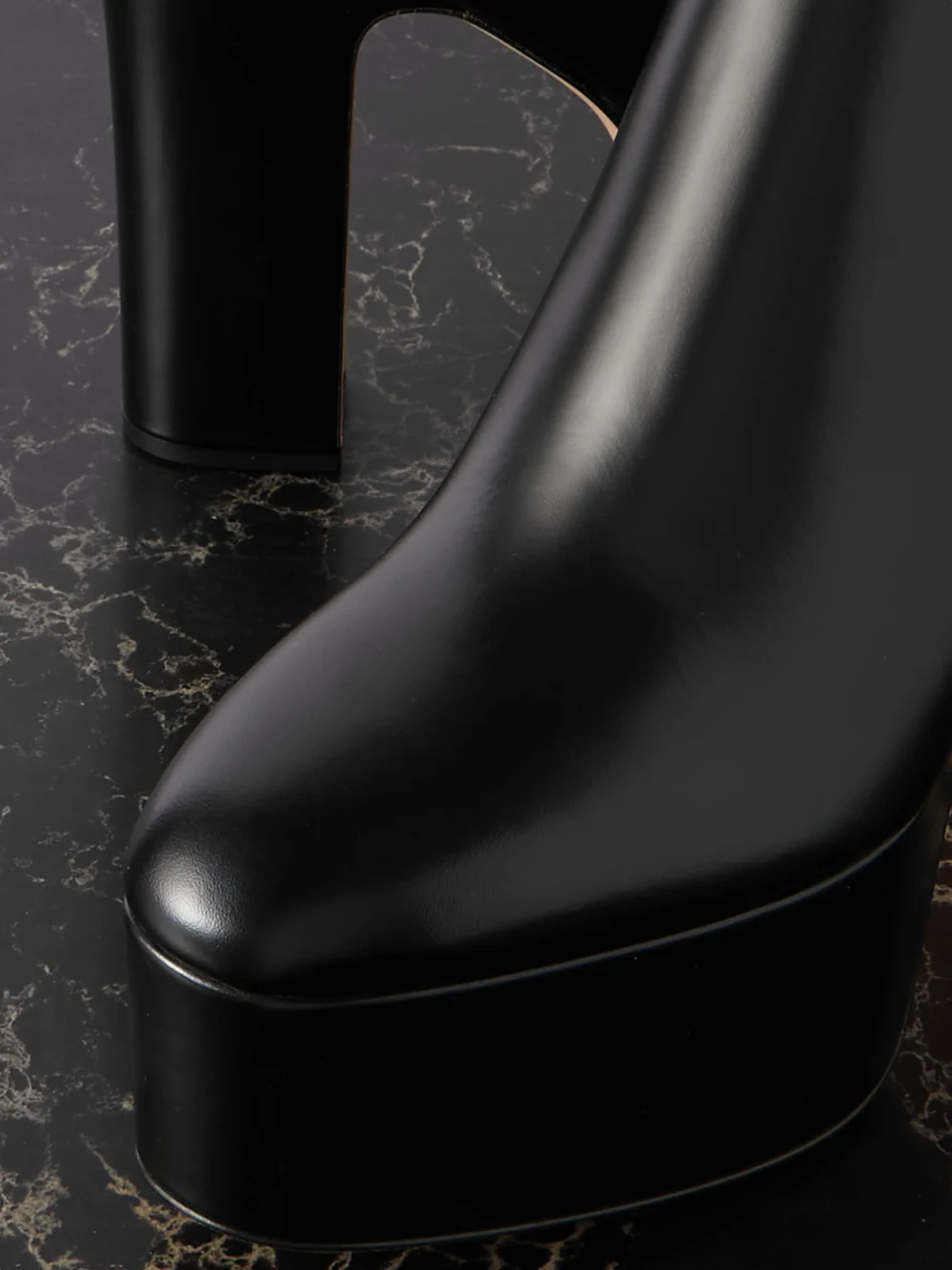 Close-up detail of the Valentino Garavani Tan-go 120 Leather Platform Ankle Boots