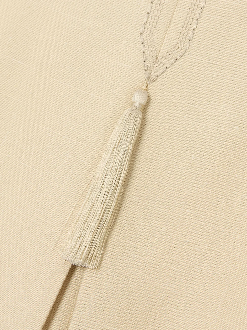 Close-up detail of the Valentino Garavani Tasseled Embroidered Woven Mini Dress
