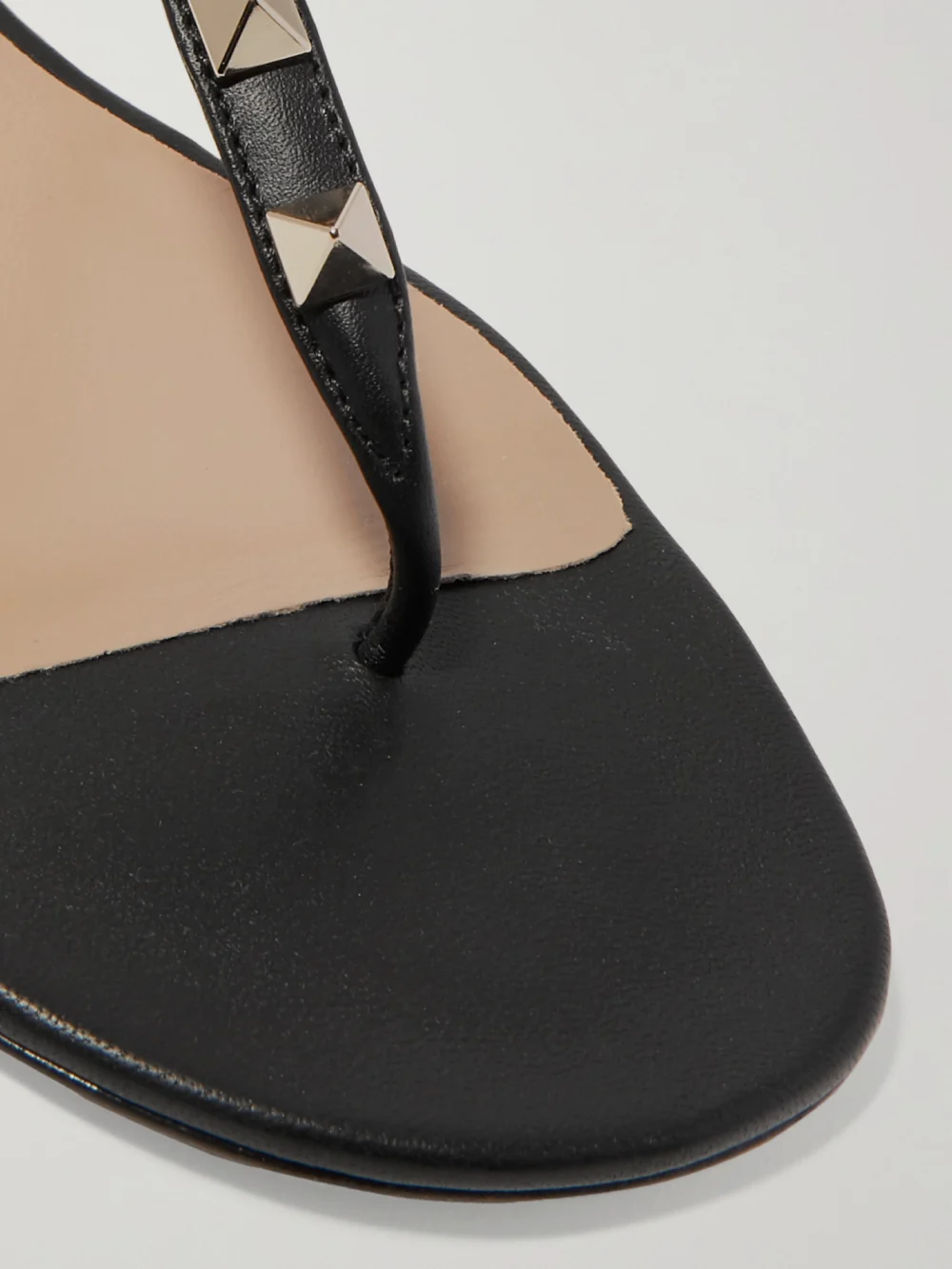Close-up detail of the Valentino Garavani The Rockstud Leather Sandals