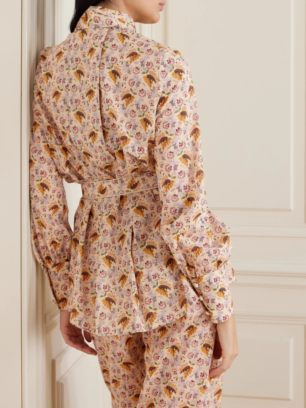 Back view of the Valentino Garavani Tie-neck Belted Pleated Floral-print Cotton-muslin Blouse