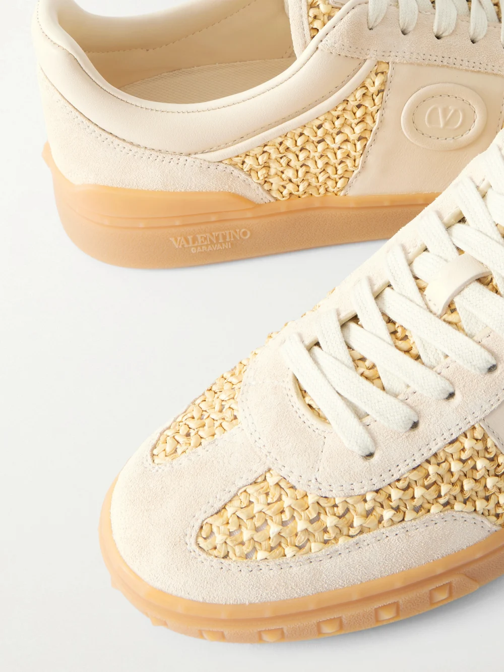 Close-up detail of the Valentino Garavani Upvillage Raffia-trimmed Suede Sneakers