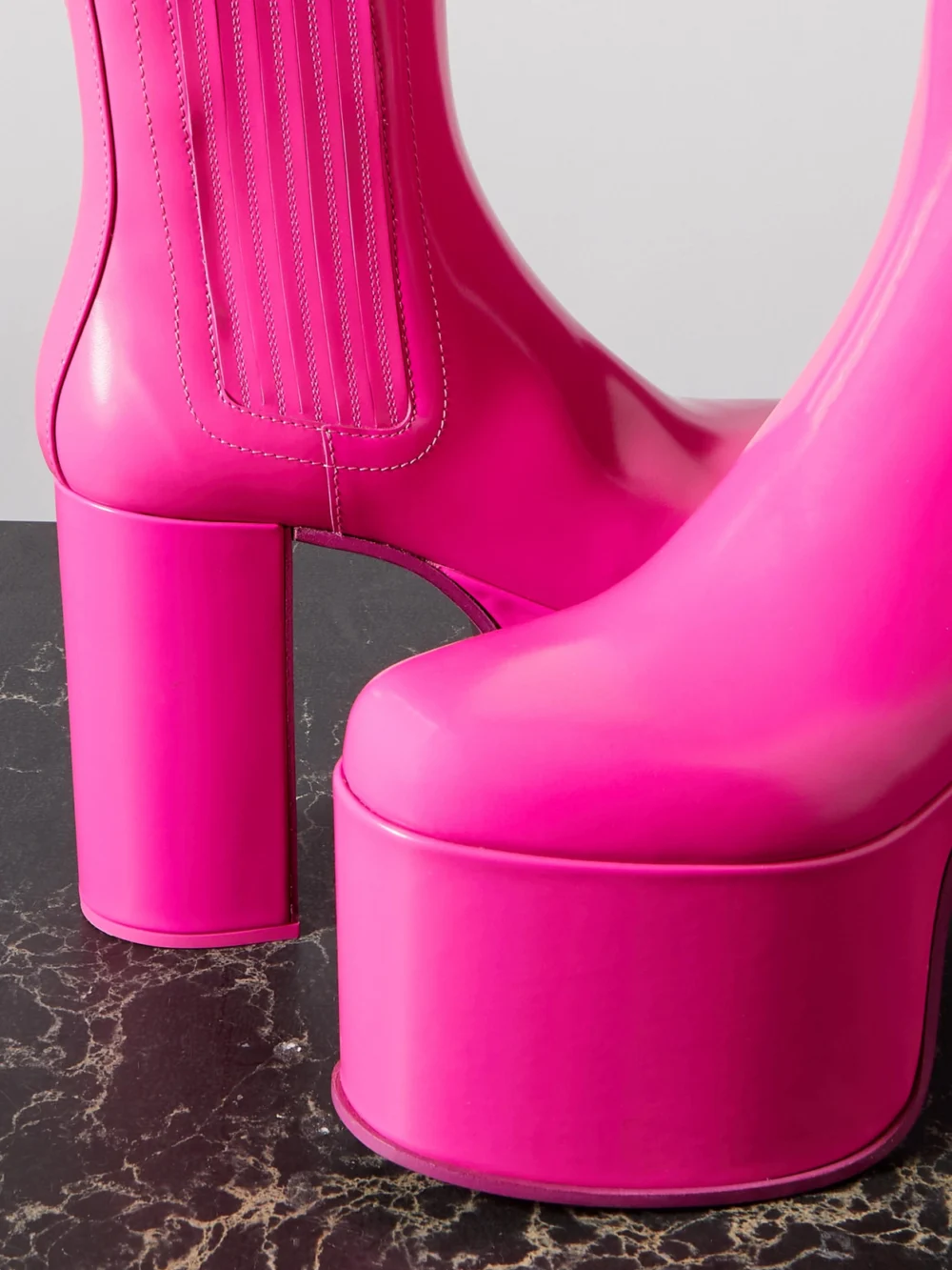 Close-up detail of the Valentino Garavani Valentino Garavani Club Beatle 125 Patent-leather Platform Ankle Boots