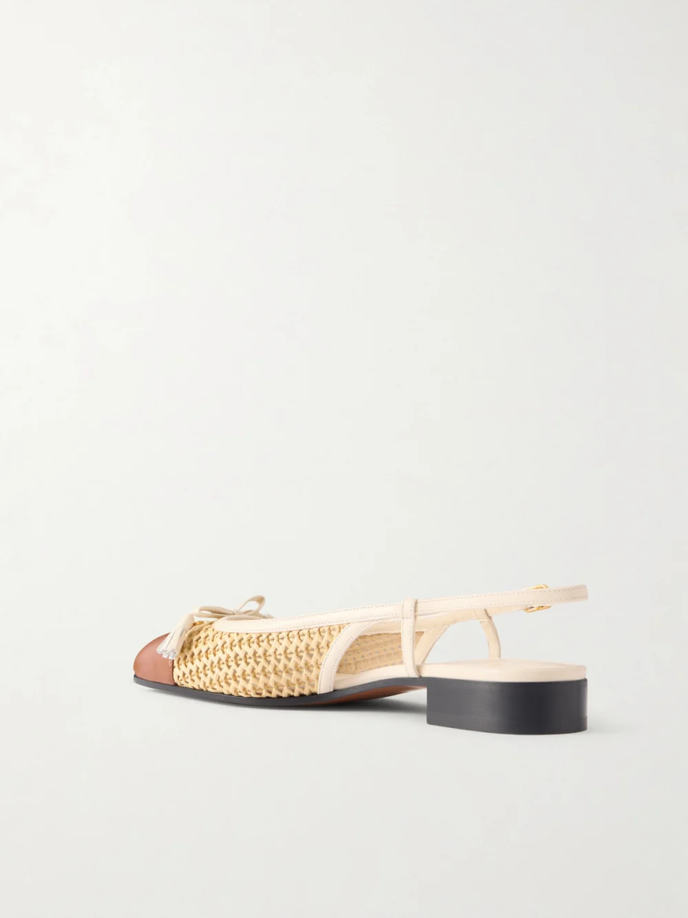 Back view of the Valentino Garavani Valet Du Roi 25 Tasseled Leather-trimmed and Raffia Slingback Ballet Flats