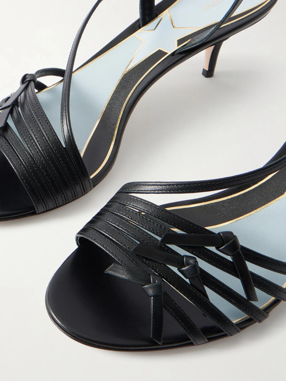 Close-up detail of the Valentino Garavani Vg Nodine 55 Bow-detailed Leather Slingback Sandals
