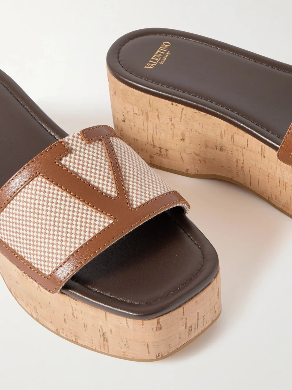 Close-up detail of the Valentino Garavani Viva Superstar Leather-trimmed Canvas Platform Slides