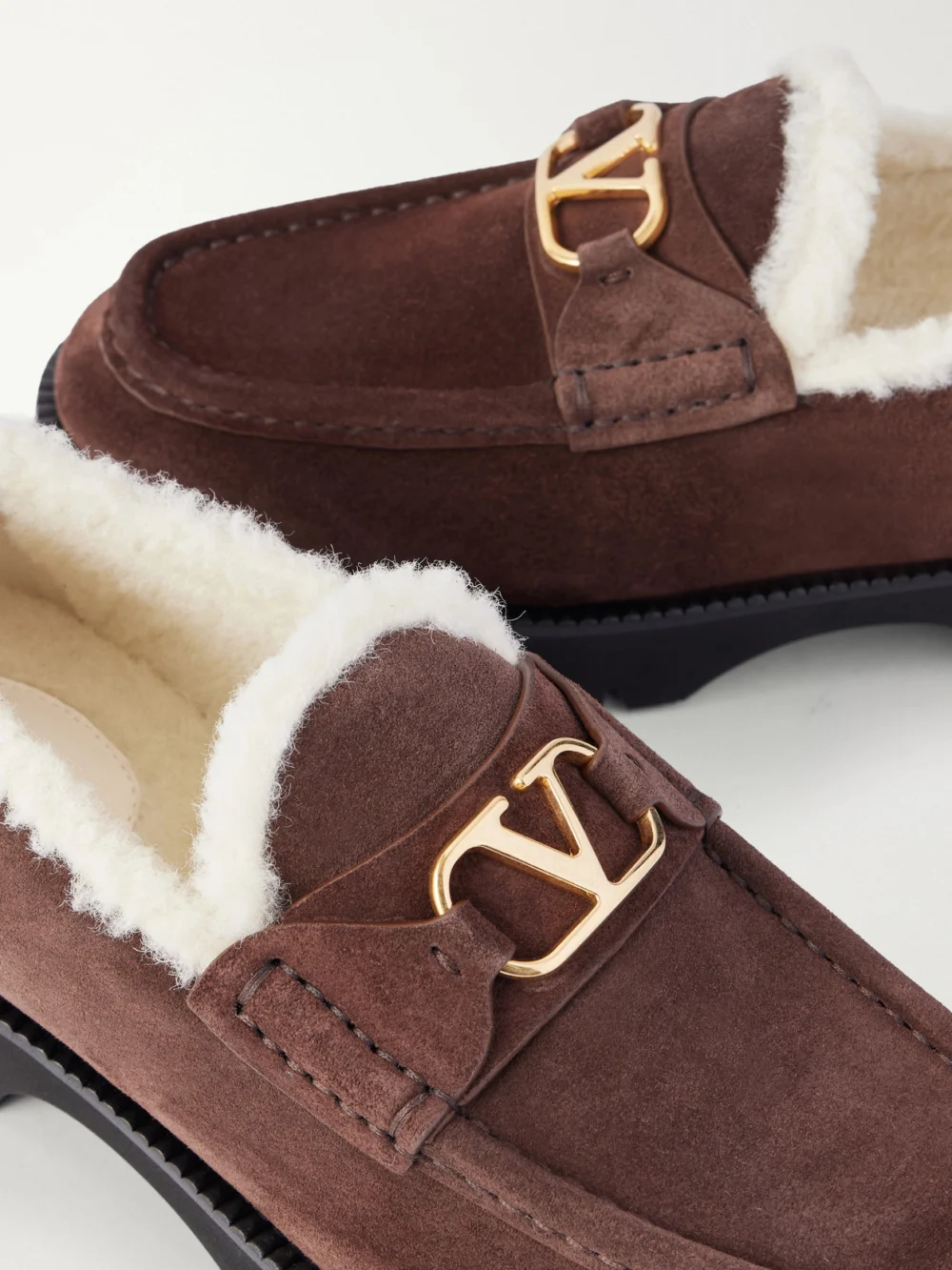 Close-up detail of the Valentino Garavani Vlogo 25 Shearling-lined Suede Loafers