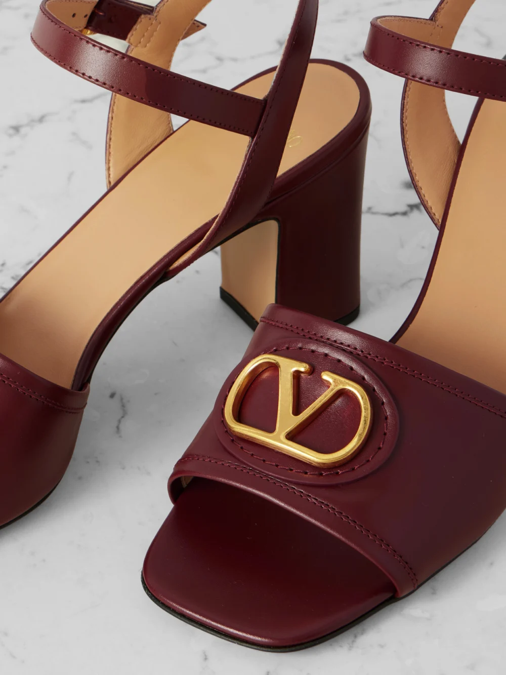 Close-up detail of the Valentino Garavani Vlogo 75 Leather Sandals