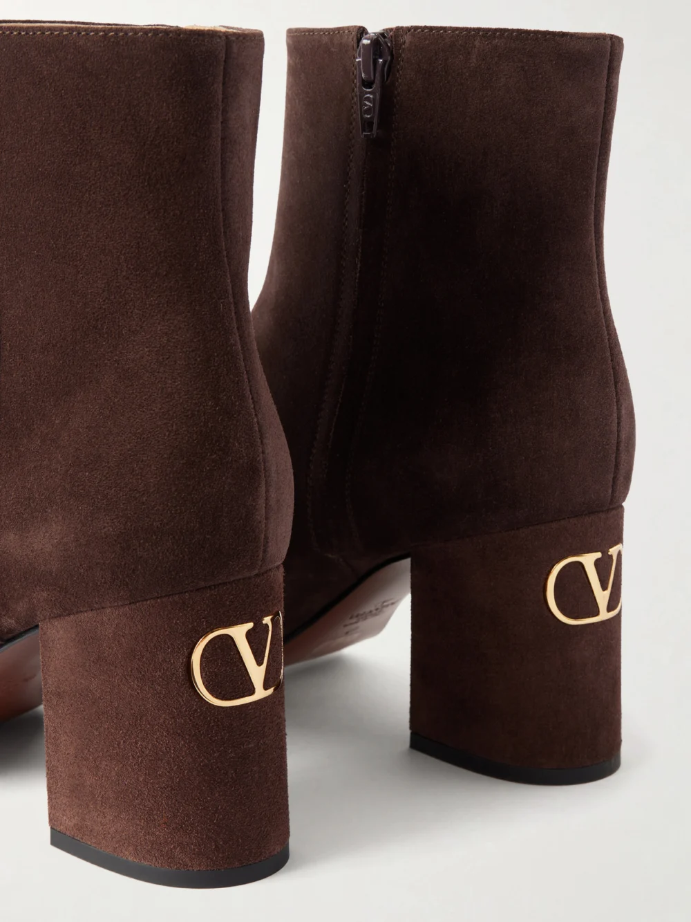 Close-up detail of the Valentino Garavani Vlogo 80 Bootie Fawcette Suede Ankle Boots