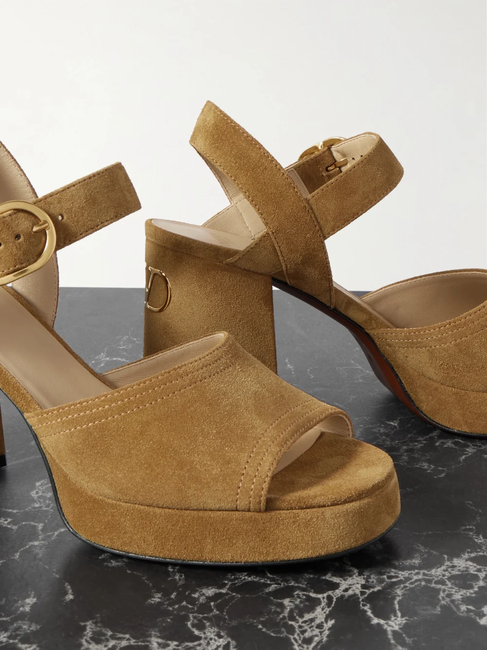 Close-up detail of the Valentino Garavani Vlogo 95 Suede Platform Sandals
