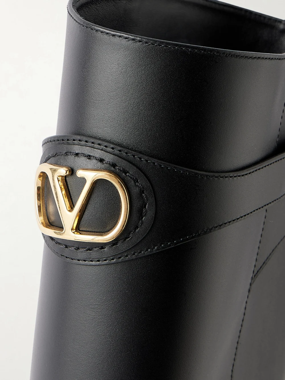 Close-up detail of the Valentino Garavani Vlogo-embellished Leather Boots