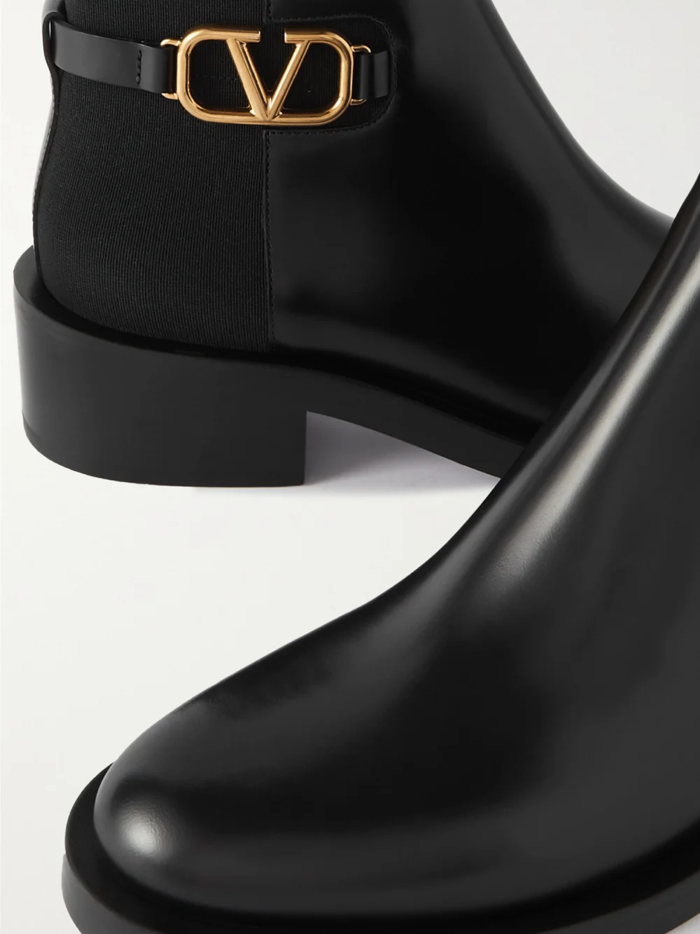 Close-up detail of the Valentino Garavani Vlogo Embellished Leather Chelsea Boots