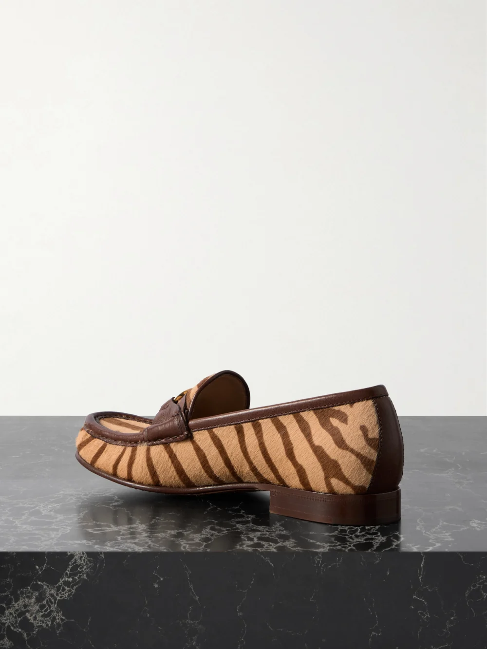 Back view of the Valentino Garavani Vlogo Signature 20 Leather-trimmed Zebra-print Calf Hair Loafers