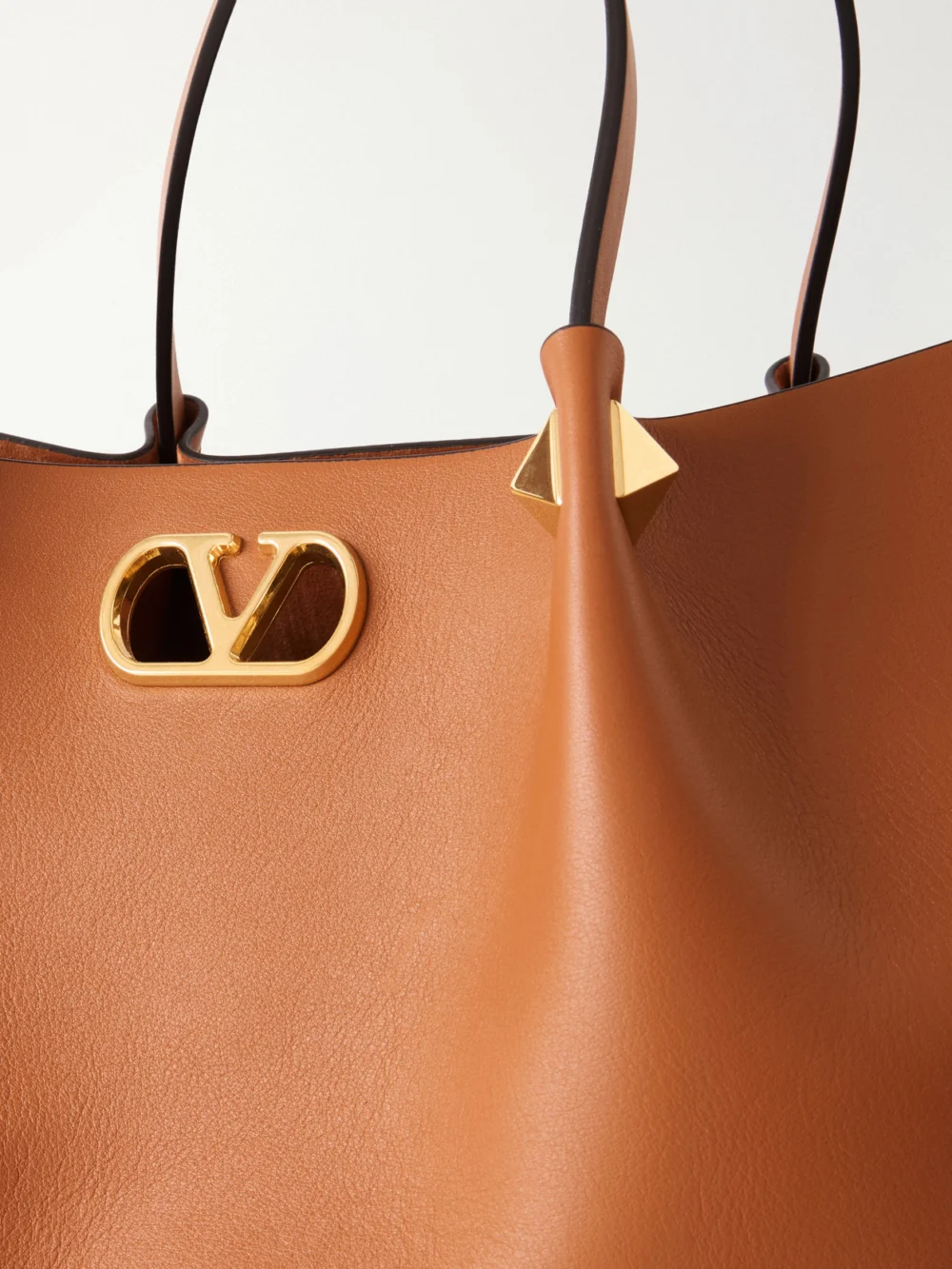 Close-up detail of the Valentino Garavani Vlogo Signature Studded Leather Tote