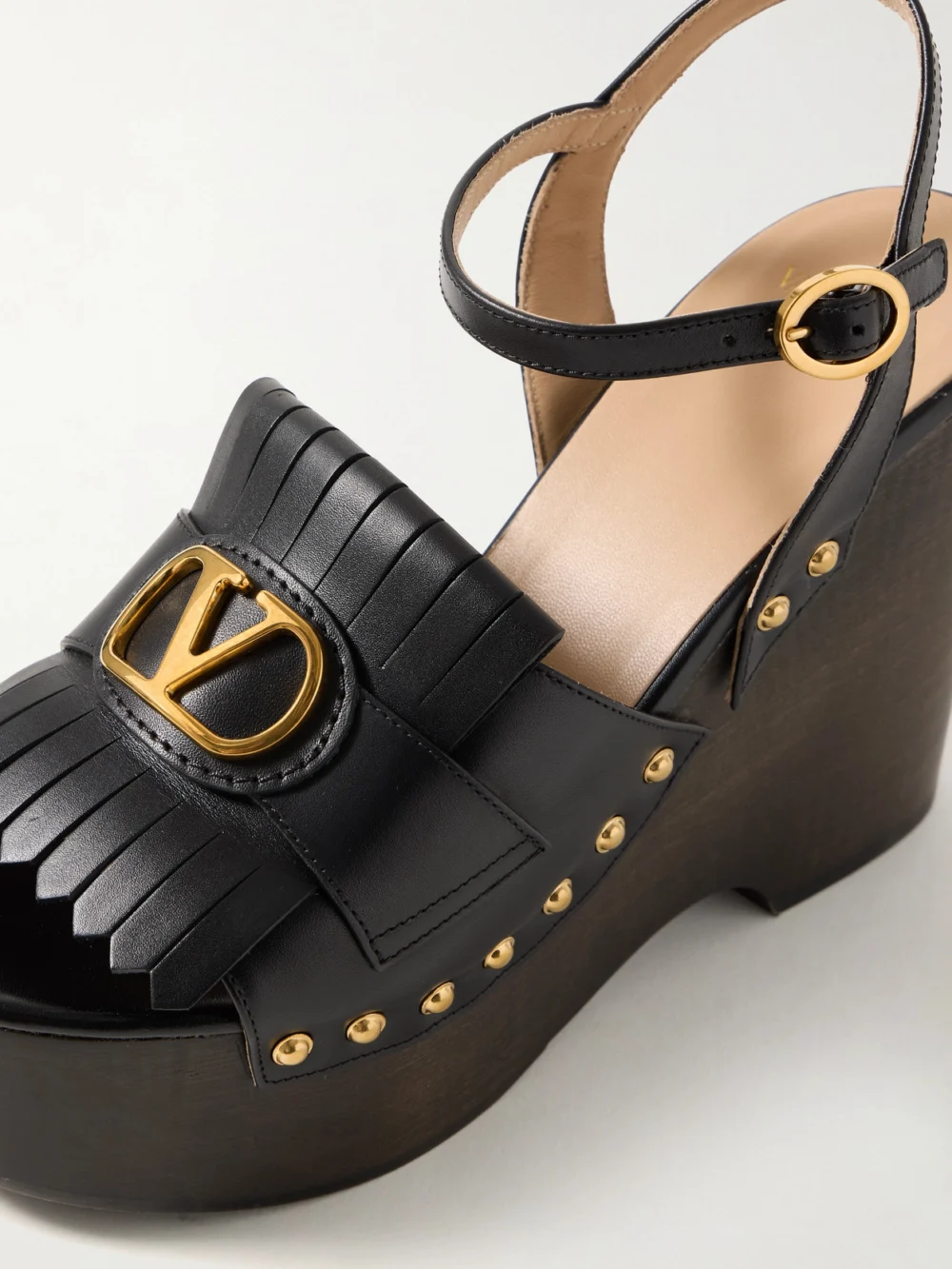 Close-up detail of the Valentino Garavani Vlogo Studded Platform Wedge Sandals