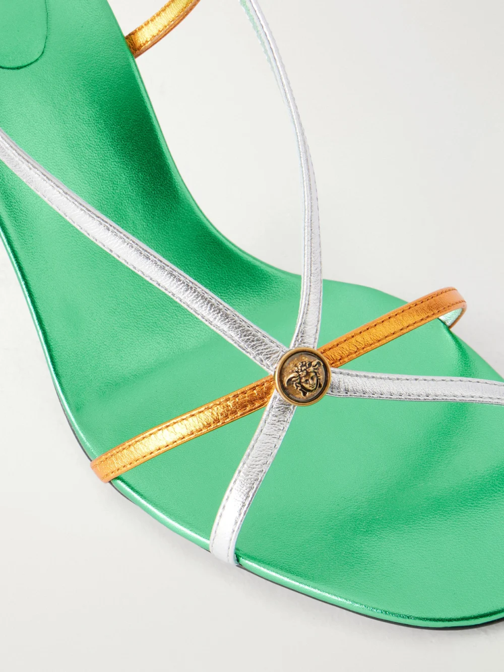 Close-up detail of the Versace 80 Metallic-leather Sandals