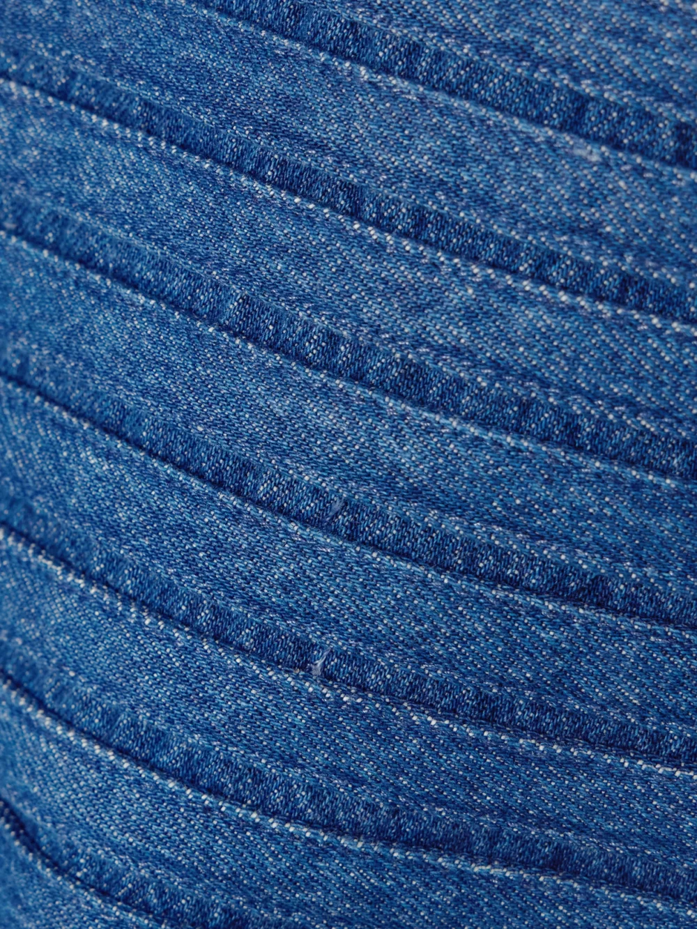 Close-up detail of the Versace Appliquéd Denim Mini Skirt