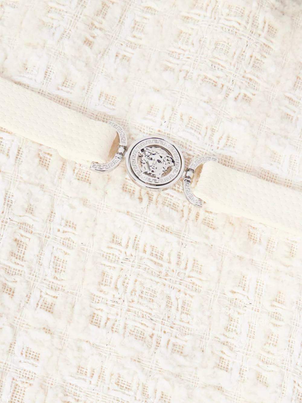 Close-up detail of the Versace Belted Metallic Cotton-blend Tweed Mini Dress