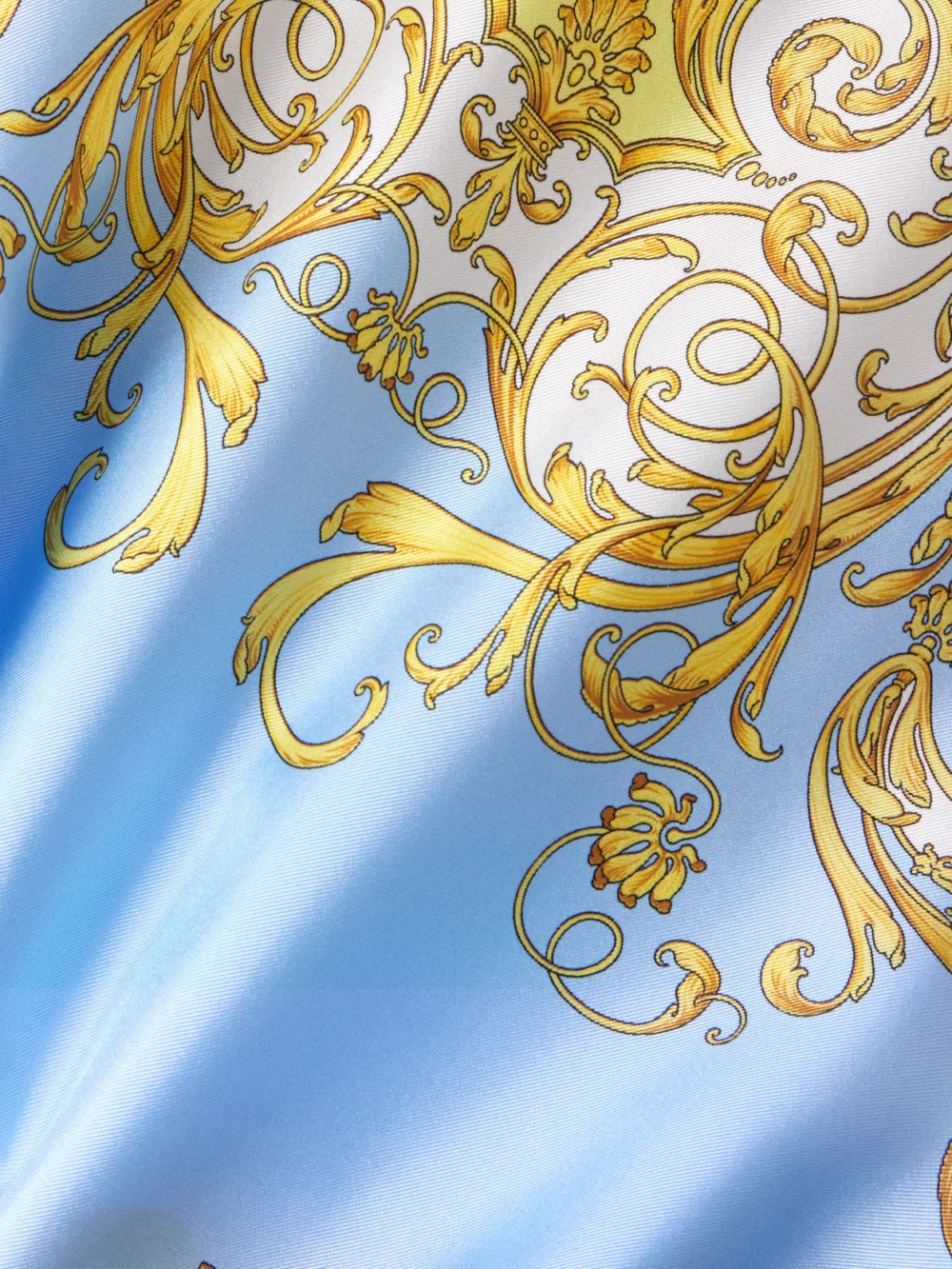 Close-up detail of the Versace Belted Printed Silk-twill Dress