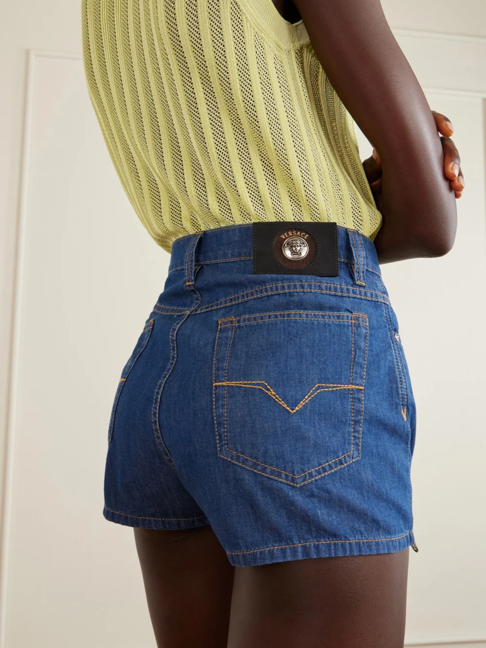 Close-up detail of the Versace Denim High-rise Shorts