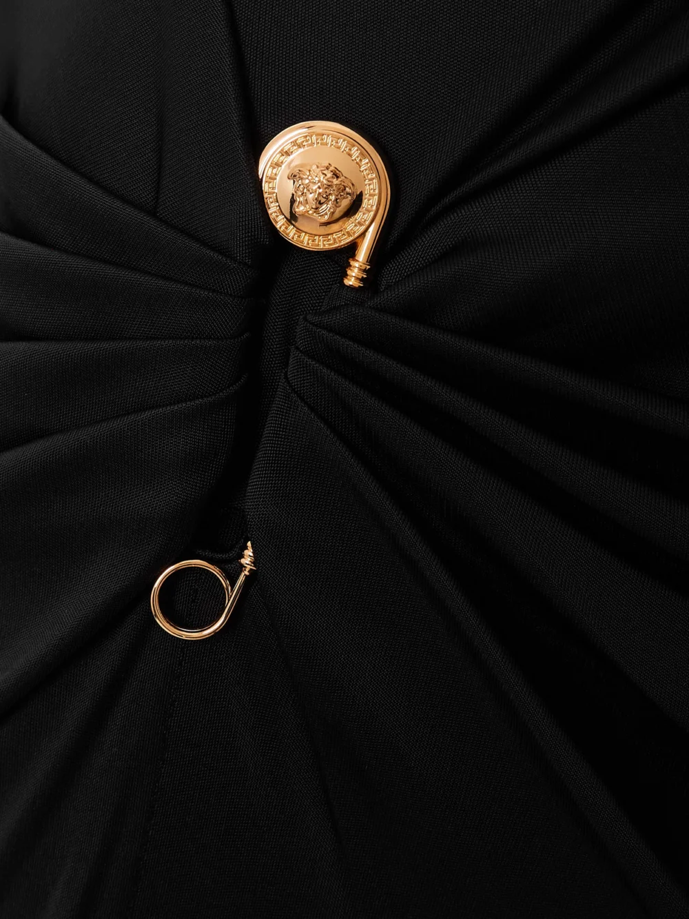 Close-up detail of the Versace Embellished Draped Stretch-jersey Gown