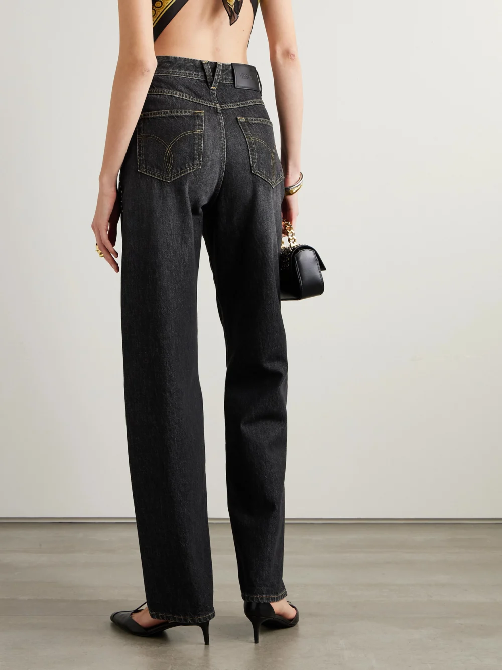 Back view of the Versace Embellished High-rise Straight-leg Jeans