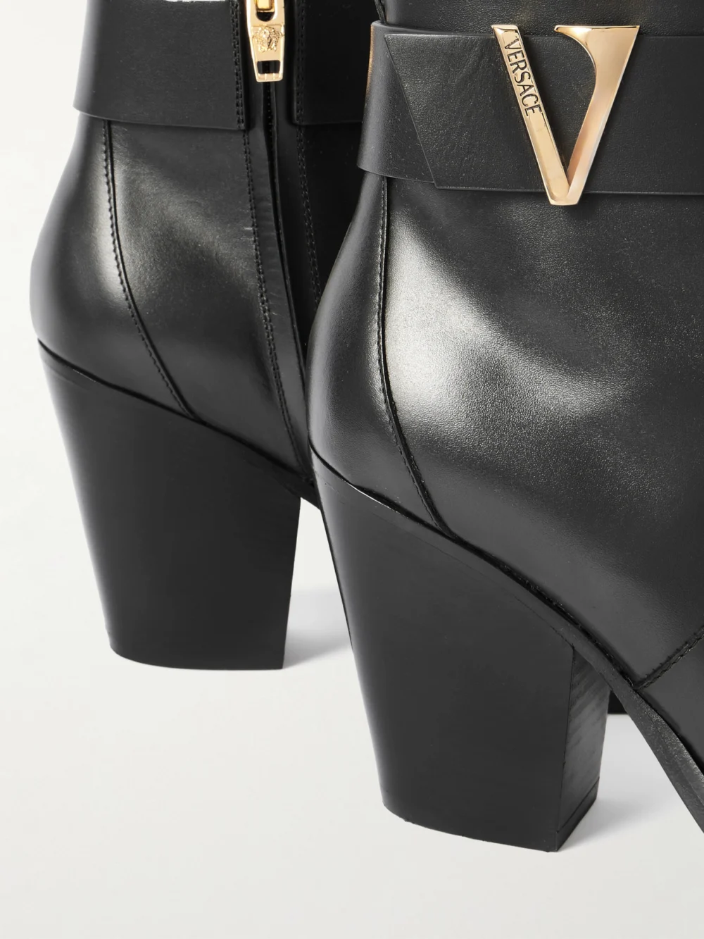 Close-up detail of the Versace Embellished Leather Ankle Boots