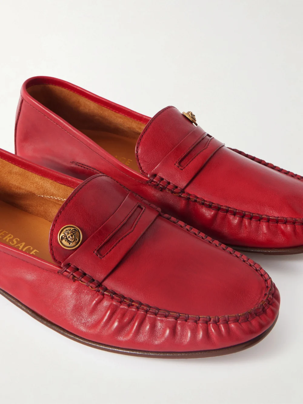 Close-up detail of the Versace Embellished Leather Loafers