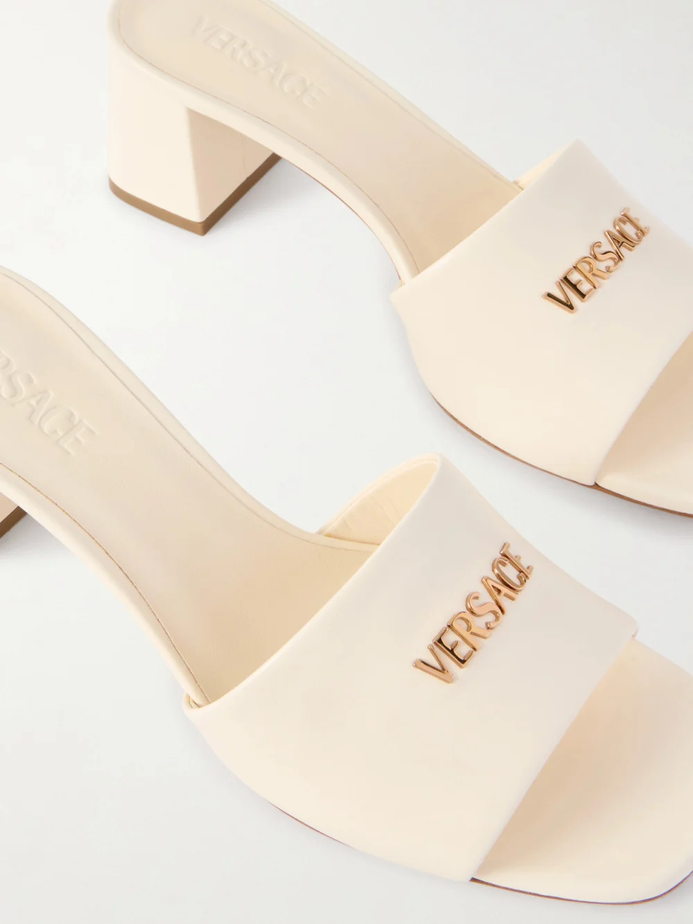 Close-up detail of the Versace Embellished Leather Mules