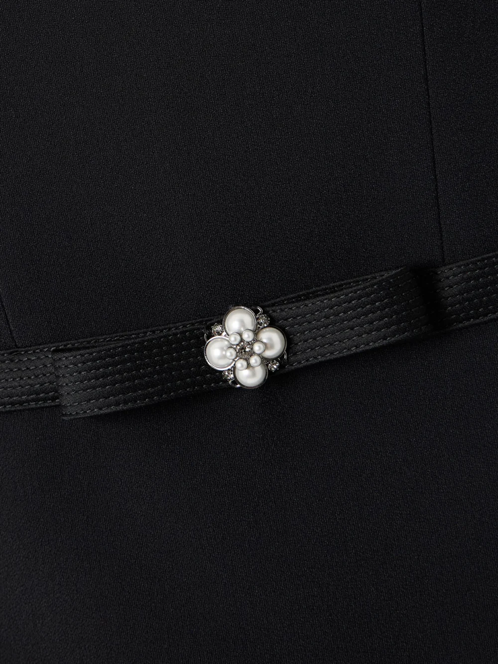 Close-up detail of the Versace Embellished Strapless Cady Mini Dress
