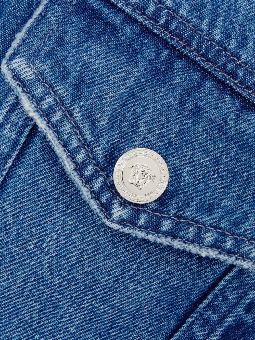 Close-up detail of the Versace Frayed Denim Shirt