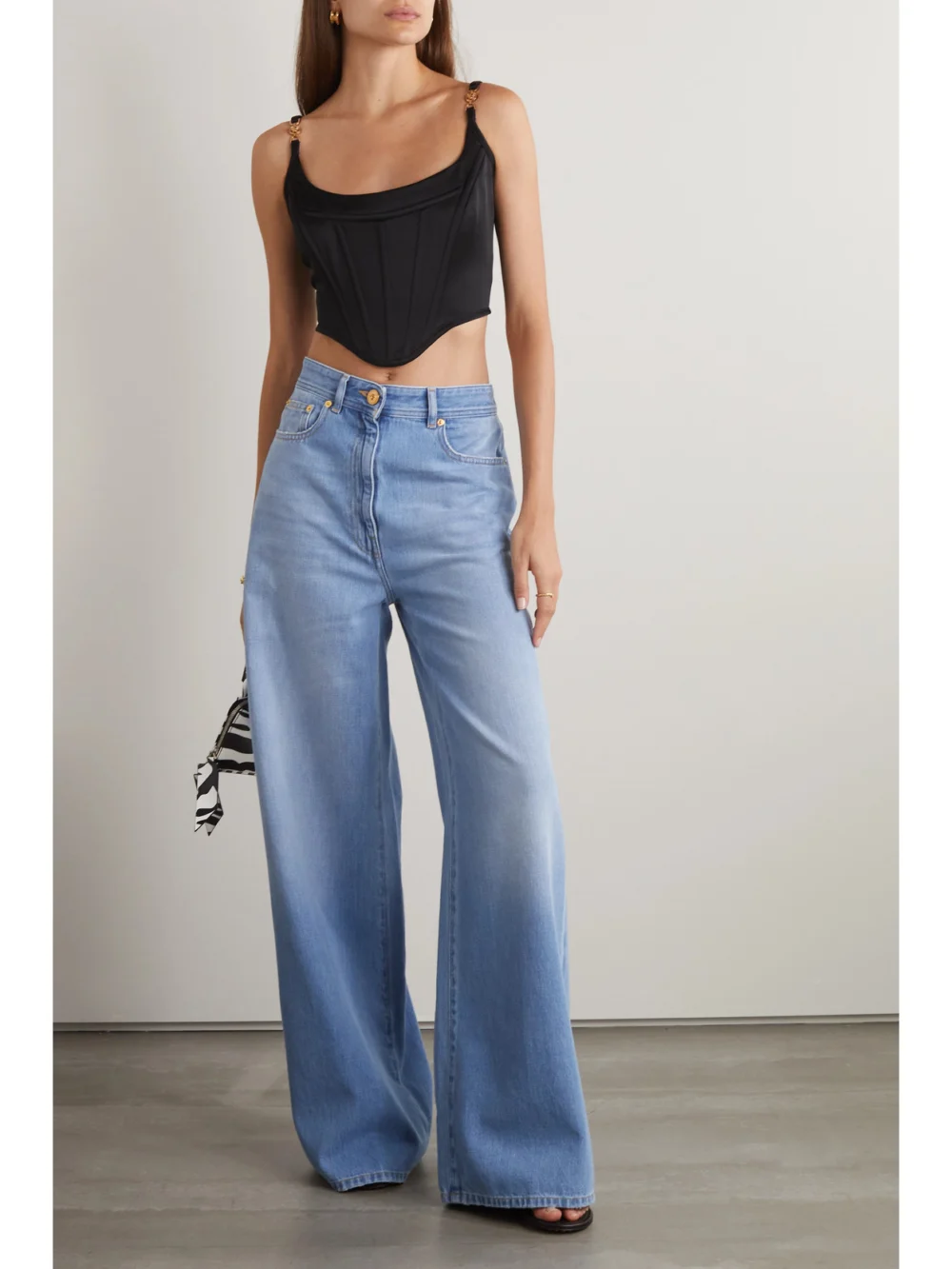 Versace Icons Cropped Embellished Satin Bustier Top, worn by a model