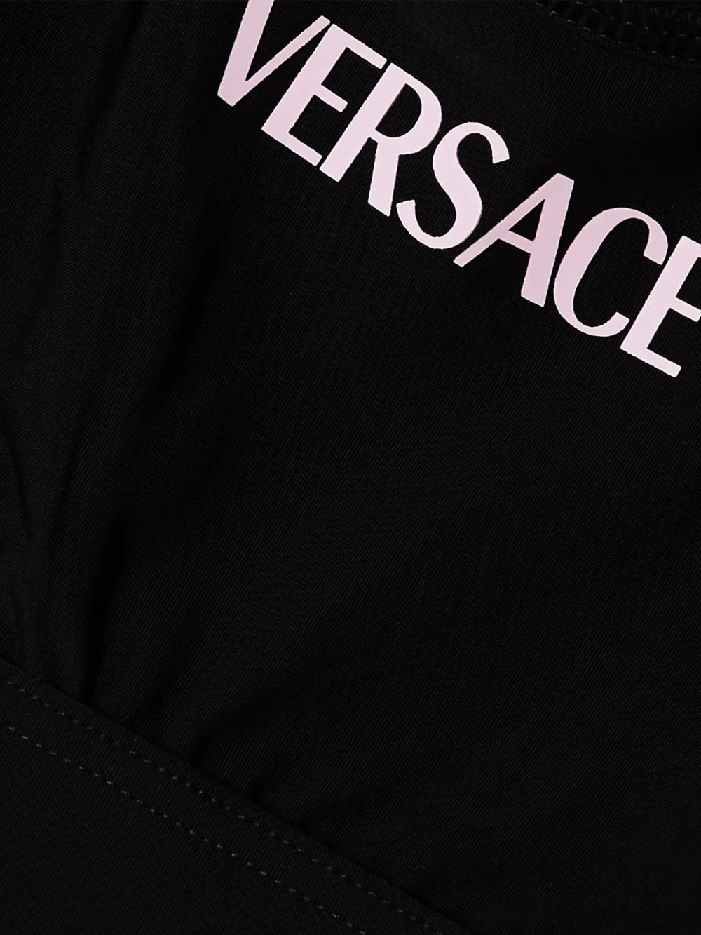 Close-up detail of the Versace La Greca Printed Stretch Sports Bra