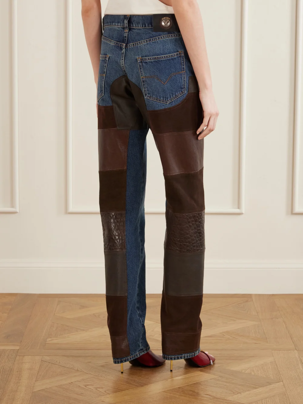 Back view of the Versace Leather-trimmed Mid-waist Straight-leg Jeans