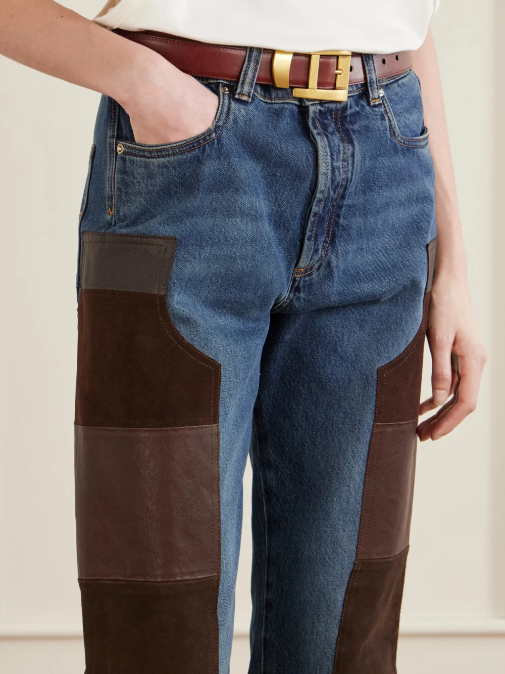 Close-up detail of the Versace Leather-trimmed Mid-waist Straight-leg Jeans
