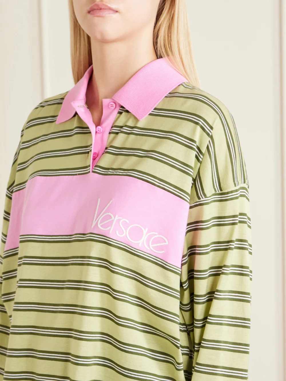 Close-up detail of the Versace Logo-embroidered Striped Cotton-jersey Polo Shirt