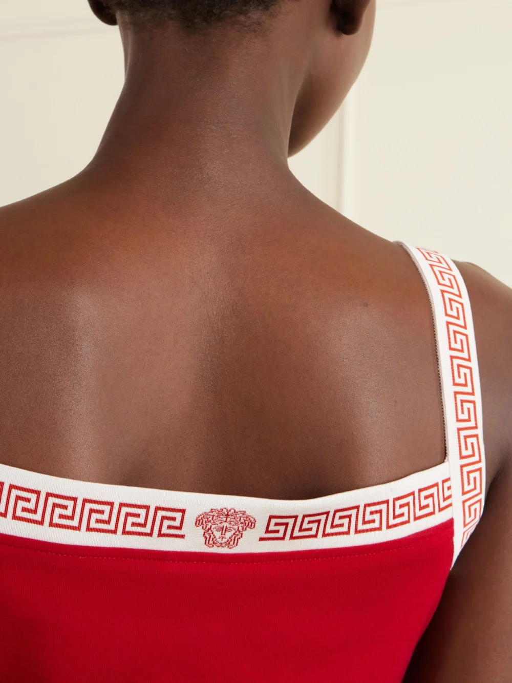 Close-up detail of the Versace Logo-jacquard Cotton-jersey Mini Dress