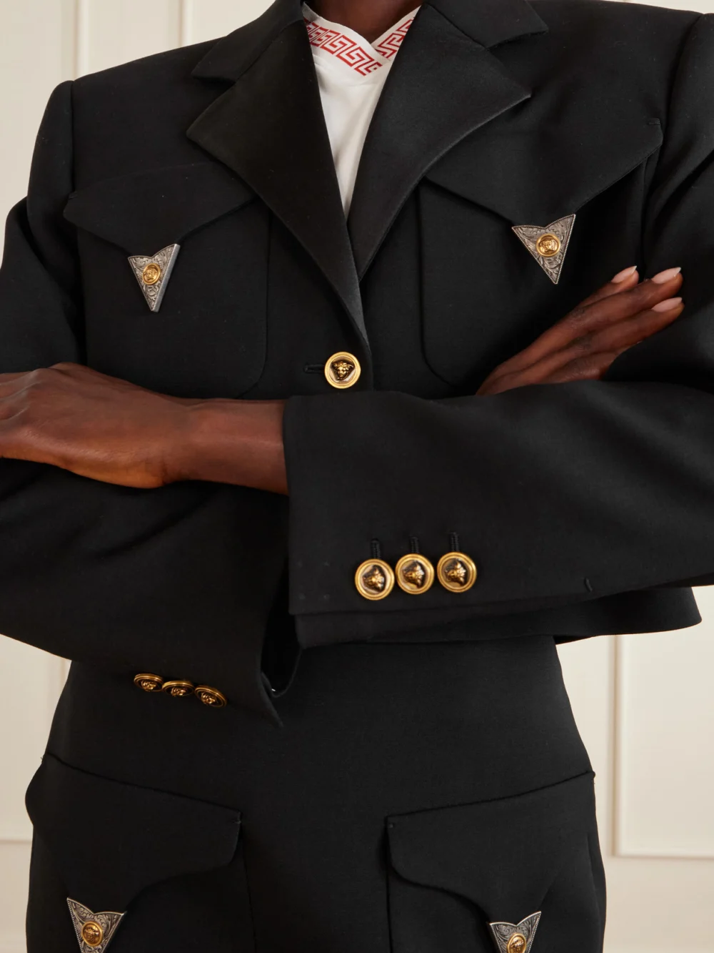 Close-up detail of the Versace Medusa-embellished Cropped Wool Jacket