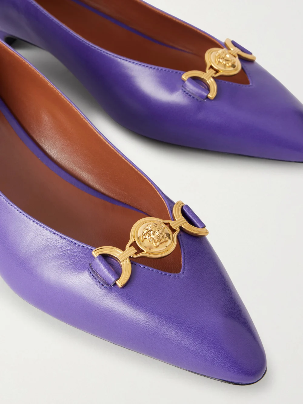 Close-up detail of the Versace Medusa-embellished Leather Ballet Flats