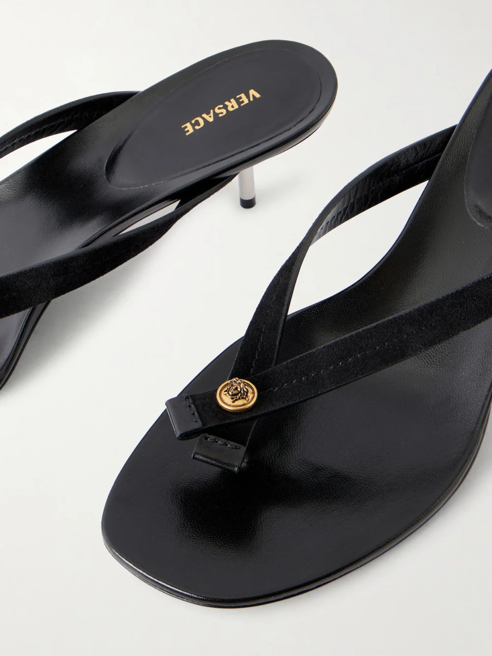 Close-up detail of the Versace Medusa-embellished Leather Thong Sandals