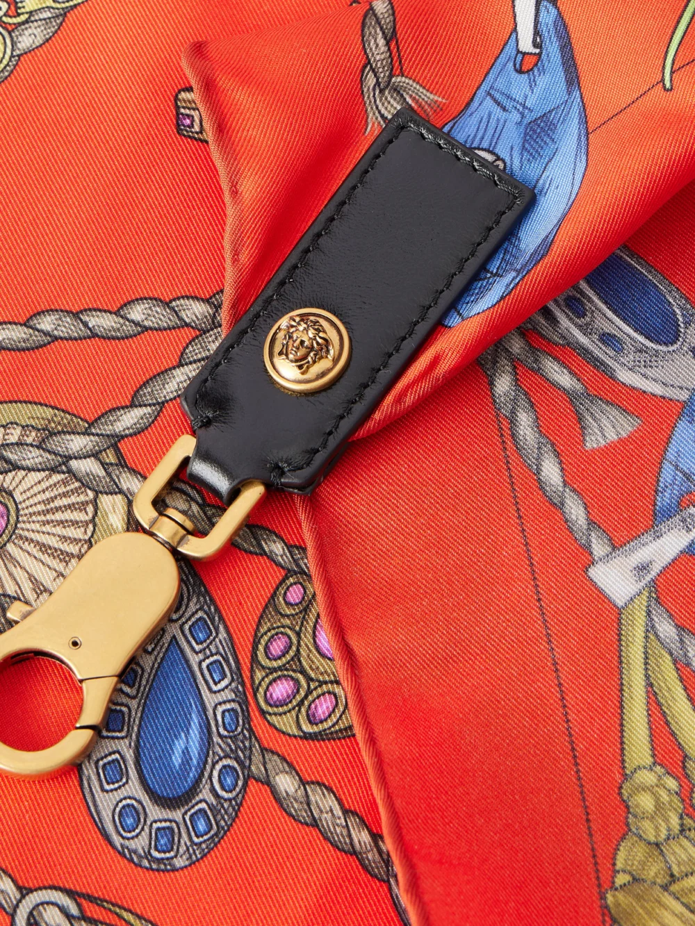 Close-up detail of the Versace Medusa-embellished Leather-trimmed Printed Silk-twill Bag Strap