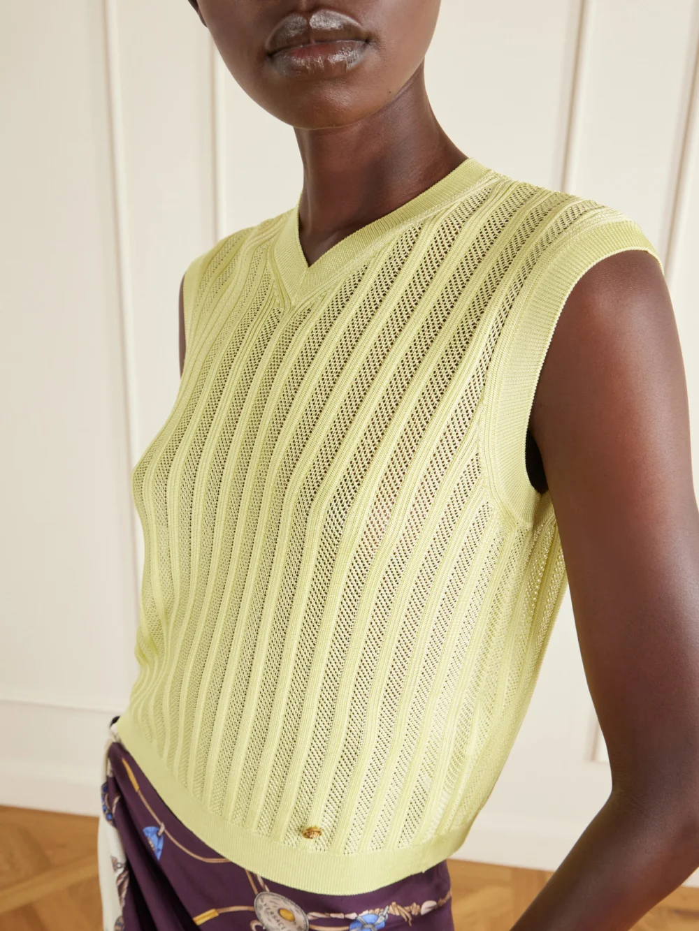 Close-up detail of the Versace Medusa-embellished Ribbed Mesh Vest
